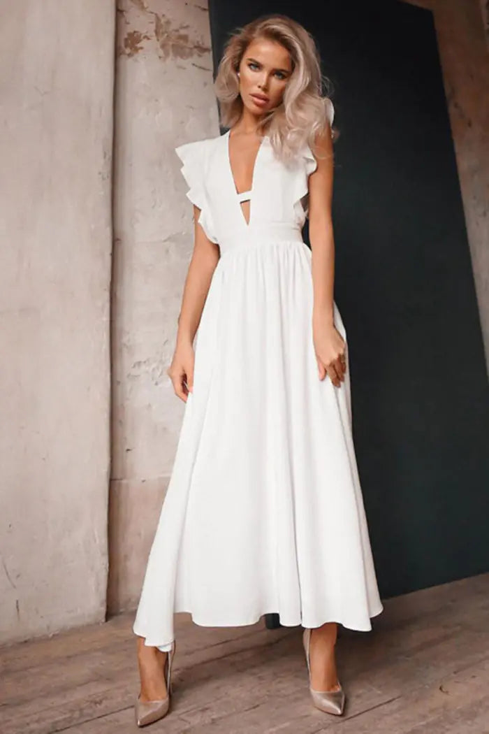 GraceFlow White Elegant Midi Dress worn by a model, showcasing its sophisticated design and flowing silhouette.